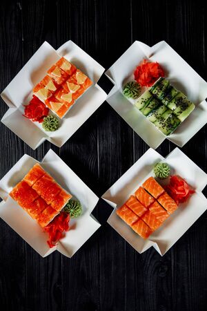 Asian cuisine, roles with fish, on a black background.の写真素材