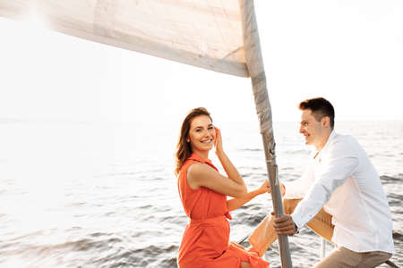 Couple in love on a yacht in the blue sea. High quality photoの写真素材