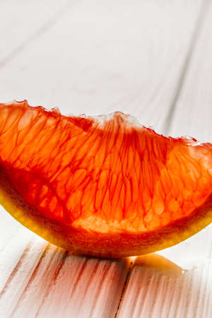 Fresh grapefruit slice on white background close-up. High quality photo