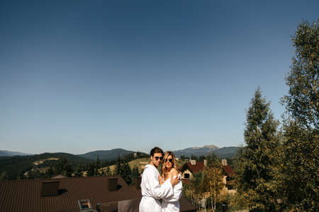 Loving couple hugging on the background of mountains. High quality photoの写真素材