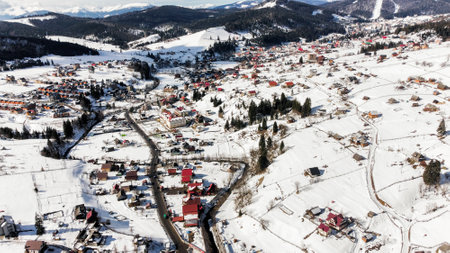 Mountains Carpathians. Beautiful view of the snowy city in the mountains. Snowy cold day, frosty weather season, snow, winter day.の写真素材