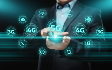 Businessman using smartphone and pressing 5g network button. Communication Technology internet network conceptの写真素材