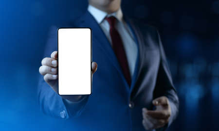 Businessman holding smartphone in hand. Business Internet technlogy concept