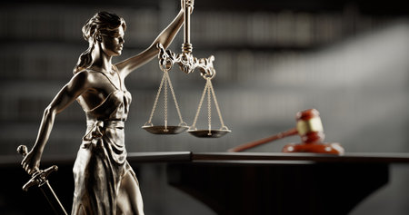 Legal Concept: Themis is the goddess of justice and the judges gavel hammer as a symbol of law and order on the background of booksの写真素材