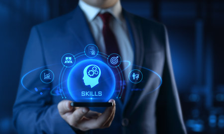 Businessman holding smartphone with Skills icons on screen - Education and E-Learning Conceptの写真素材