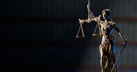 Legal Concept: Themis is Goddess of Justice and law on the background of booksの写真素材