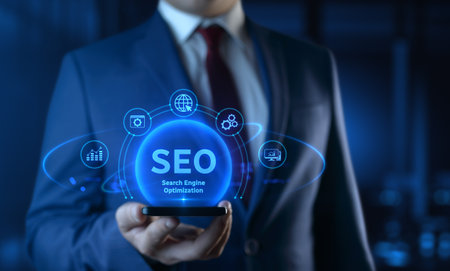 Businessman holding smartphone with Search Engine Optimization SEO icons on screen - Digital Marketing Conceptの写真素材