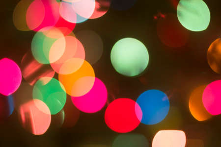 color  bokeh on dark backgroundの写真素材