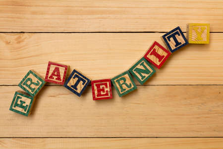 fraternity wood cube words on wooden tableの写真素材