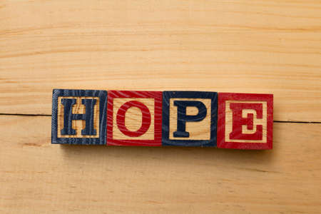 Hope wood cube words on wooden tableの写真素材