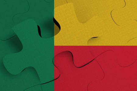 Composition of the concept of crisis and integration of a country   Benin   FLAG PAINTED ON PUZZLE 3D RENDERの写真素材