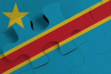 Composition of the concept of crisis and integration of a country   Democratic Republic of the Congo   FLAG PAINTED ON PUZZLE 3D RENDERの写真素材