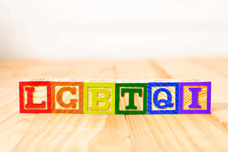 Spectacular colorful wooden cubes with the colors of the LGBTQ gay pride flag with the word LGBTQI.の写真素材