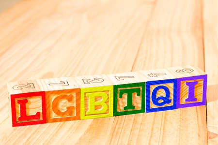 Spectacular colorful wooden cubes with the colors of the LGBTQ gay pride flag with the word LGBTQI.の写真素材