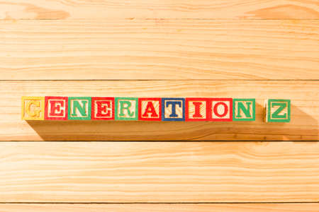Spectacular wooden cubes with the word GENERATION Z on a wooden surface.の写真素材