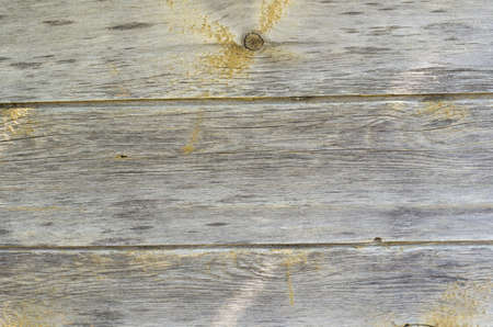 Old wood with scuffs  fraying and knots backgroundの写真素材
