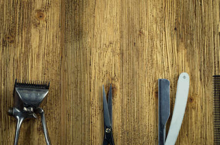 Vintage barber shop tools on old wooden backgroundの写真素材