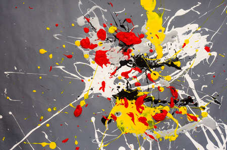 multicolored color spill blemish on the gray background.の写真素材