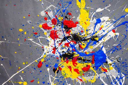multicolored color spill blemish on the gray background.の写真素材