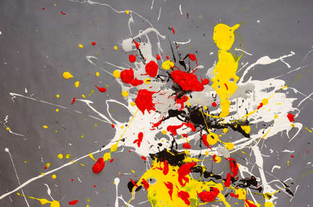 multicolored color spill blemish on the gray background.の写真素材