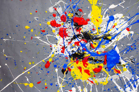 multicolored color spill blemish on the gray background.の写真素材