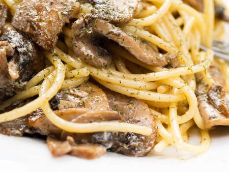 tasty Italian pasta with mushrooms close up.の写真素材