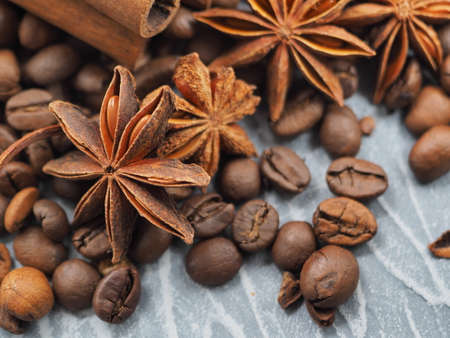 coffee cinnamon and star anise on gray background close upの写真素材