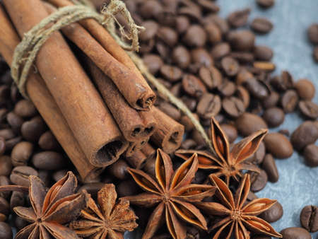 coffee cinnamon and star anise on gray background close upの写真素材