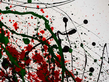 Dripping green and black and red paint isolated on white background. Flowing fuel oil splashes, drops and trail.の写真素材