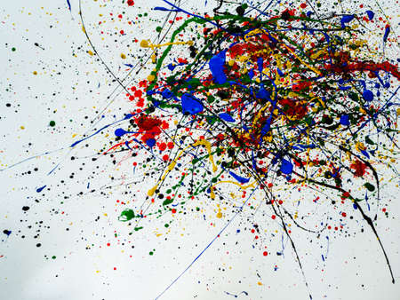 an abstraction with splashes of black and red and green and yellow and blue paint on a white...