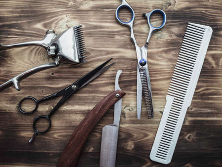 vintage barber shop tools on wood backgroundの写真素材