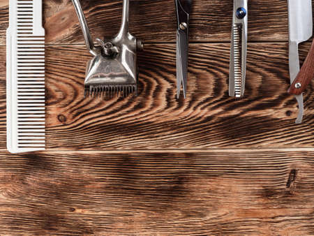Barber Tools On Wooden Background.