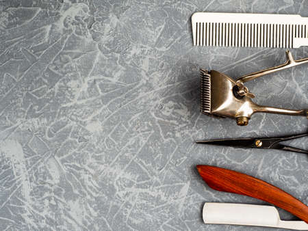 Tools for cutting beard barbershop on gray concrete background top view. copy spaceの写真素材