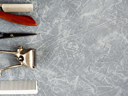 Tools for cutting beard barbershop on gray concrete background top view. copy spaceの写真素材