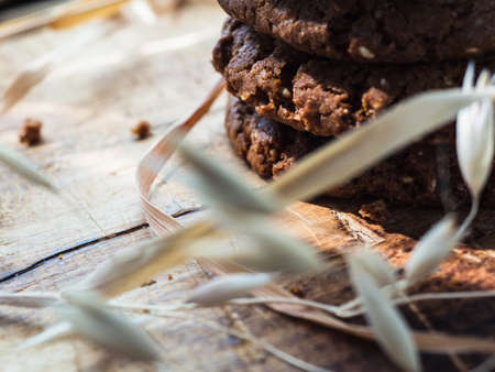 oatmeal cookies oats and milk on a wooden background.
