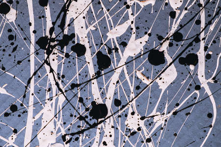 Abstract expressionism. Picture painted using the technique of dripping. Mixing different colors white and black. Lines and spots. Horizontal orientation.の写真素材