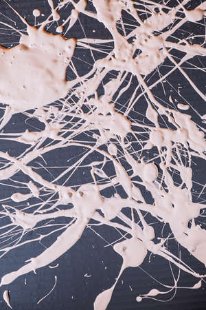 Abstract expressionism. Picture painted using the technique of dripping. Mixing white colors . Lines and spots. Vertical orientation.の写真素材