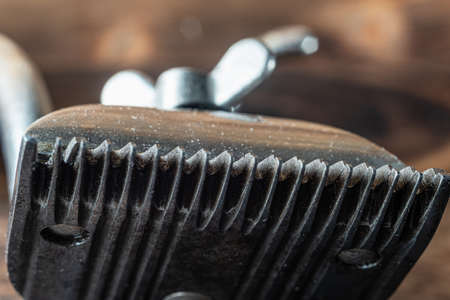 vintage manual clipper. Horizontal orientation. Wood background. close-up.