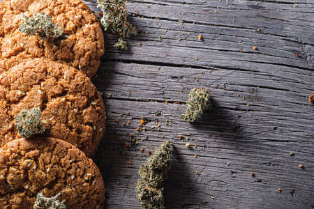 biscuits with hemp on an old wooden background close-up. rustic. Horizontal orientation.の写真素材