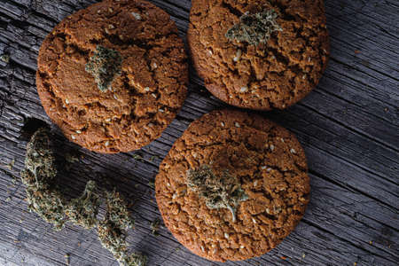 biscuits with hemp on an old wooden background close-up. rustic. Horizontal orientation.の写真素材