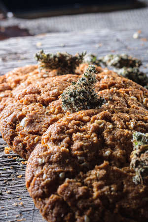 biscuits with hemp on an old wooden background close-up. rustic. Vertical orientation.の写真素材