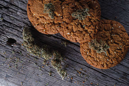 biscuits with hemp on an old wooden background close-up. rustic. Horizontal orientation.の写真素材