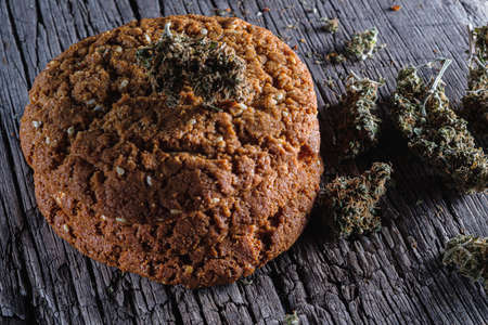 biscuits with hemp on an old wooden background close-up. rustic. Horizontal orientation.の写真素材