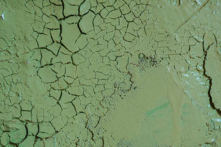 Old dirty painted wall. Several layers of peeling paint. background texture. Horizontal orientation