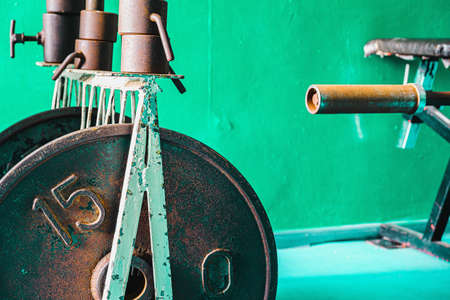 Old rusty sports weights for the barbell in the old room. Horizontal orientationの写真素材