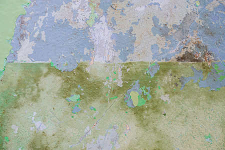 Old dirty painted wall. Several layers of peeling paint. rusty blur. background texture. Horizontal...