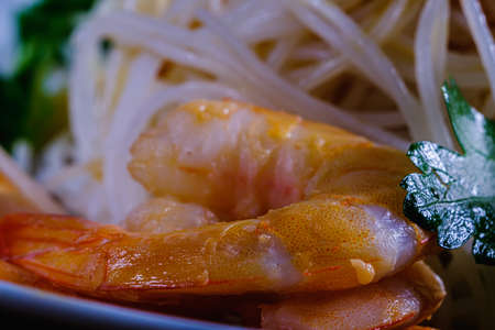 Shrimp and delicious rice noodles with vegetables. macro. Horizontal