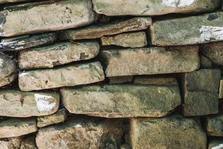 The ancient rusty old masonry stone texture for background and design concepts. the shadow. geology....