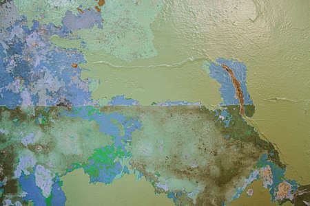 Old dirty painted wall. Several layers of peeling paint. rusty blur. background texture. Horizontal orientationの写真素材