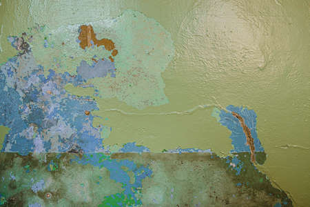 Old dirty painted wall. Several layers of peeling paint. rusty blur. background texture. Horizontal...